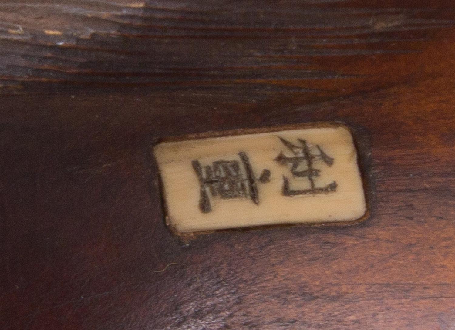 A Japanese Boxwood Netsuke Length 3 1/4 inches.