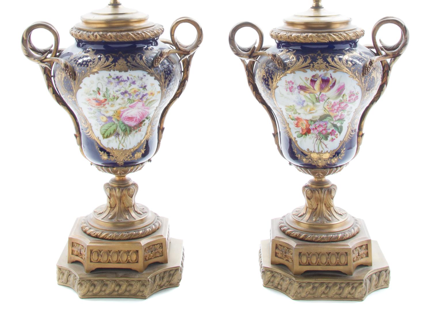 A Pair of Sevres Style Gilt Bronze Mounted Urns Height overall 26 1/2 inches. — 19TH/20TH CENTURY