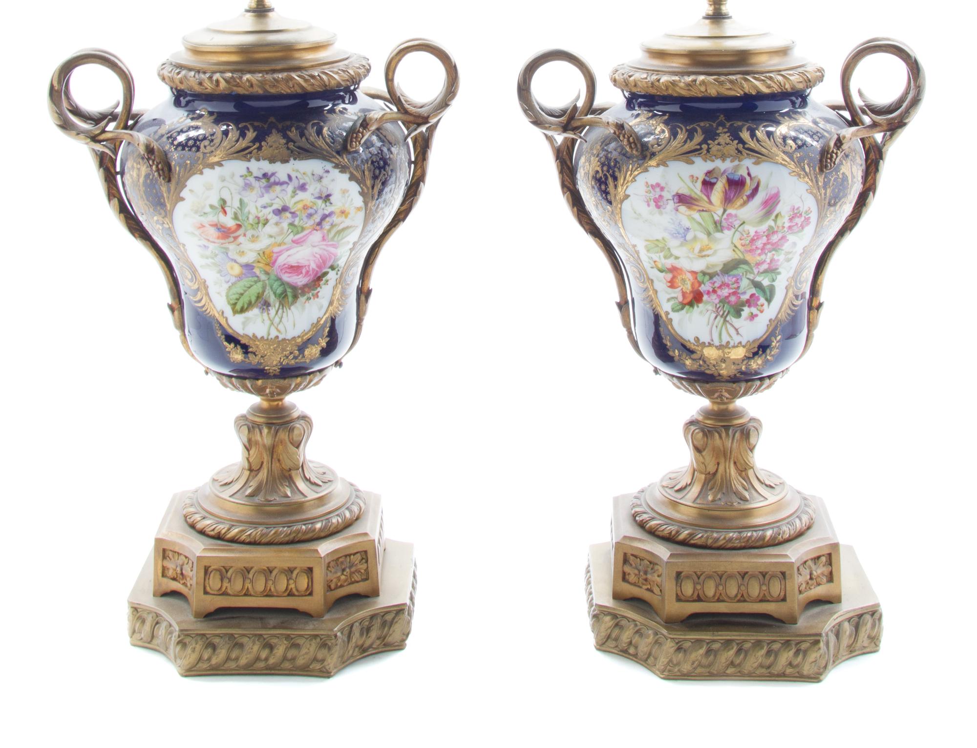 A Pair of Sevres Style Gilt Bronze Mounted Urns Height overall 26 1/2 inches. — 19TH/20TH CENTURY