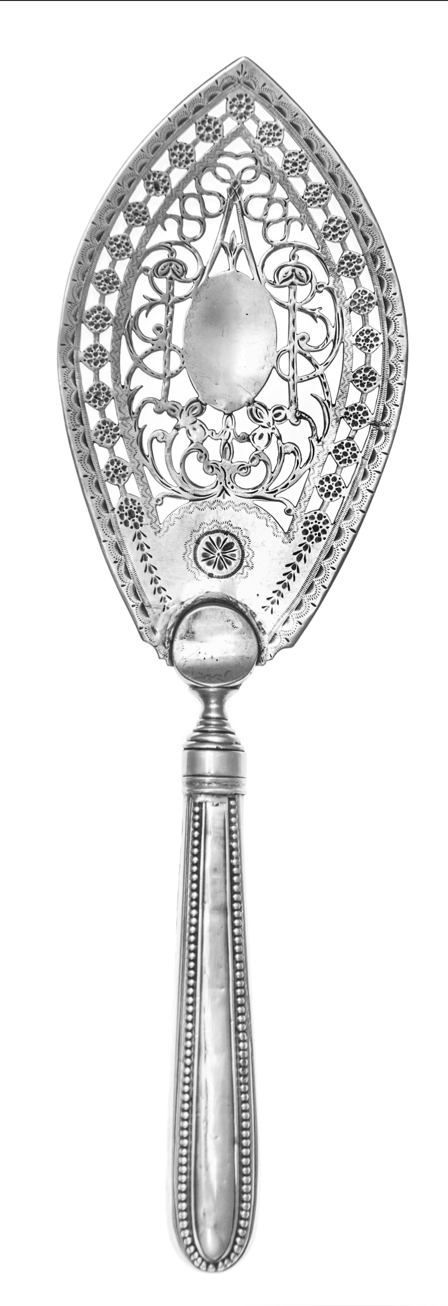 A George III Silver Fish Server, Benjamin Montague, London, 1824, having a beaded handle, the blade with openwork floral and vine decor