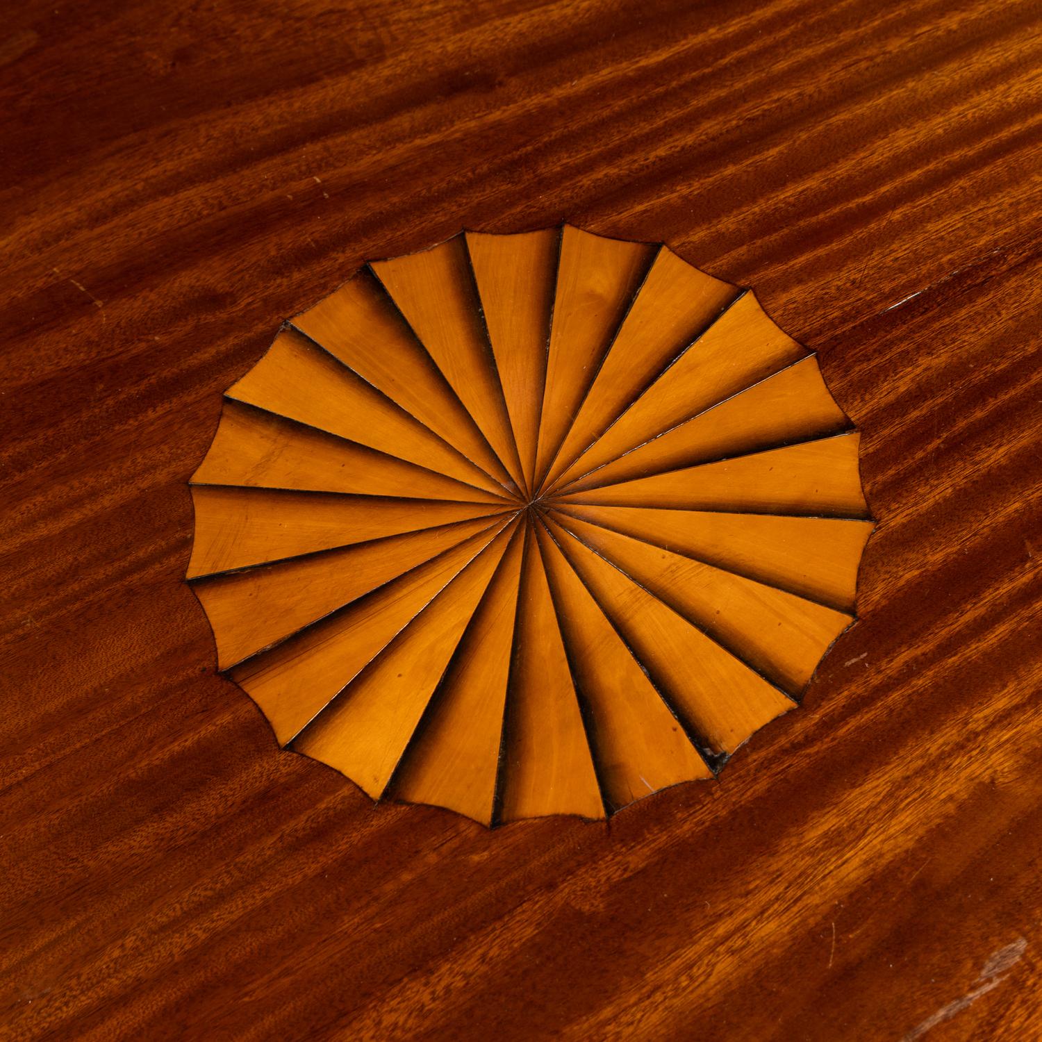 A Regency Style Mahogany and Marquetry Center Table