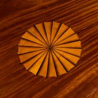 A Regency Style Mahogany and Marquetry Center Table