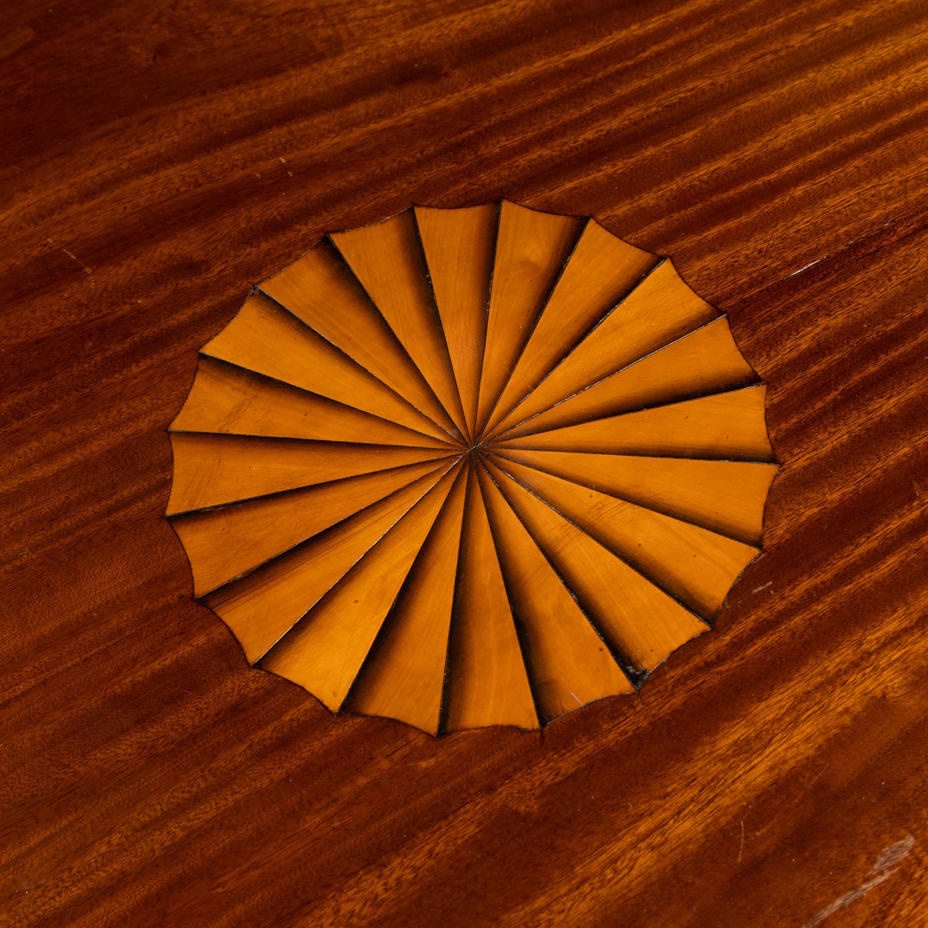 A Regency Style Mahogany and Marquetry Center Table