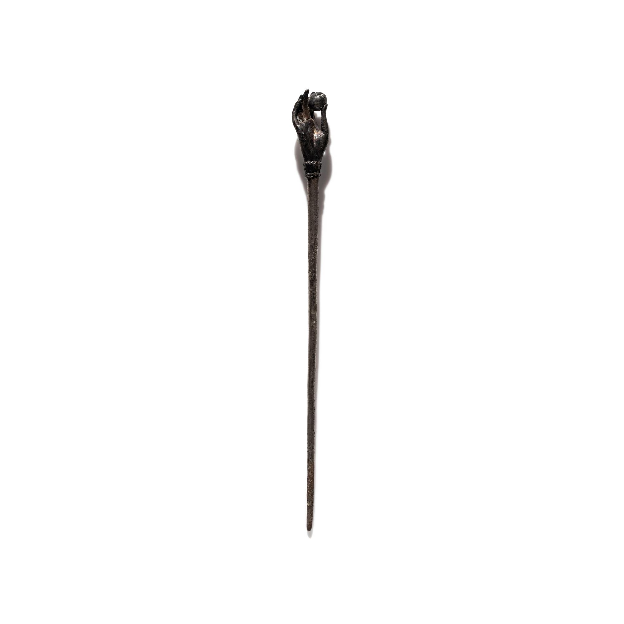 A Roman Silver Stickpin with a Hand and Pomegranate Finial