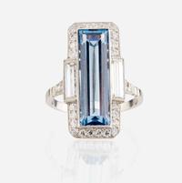An aquamarine, diamond, and platinum ring