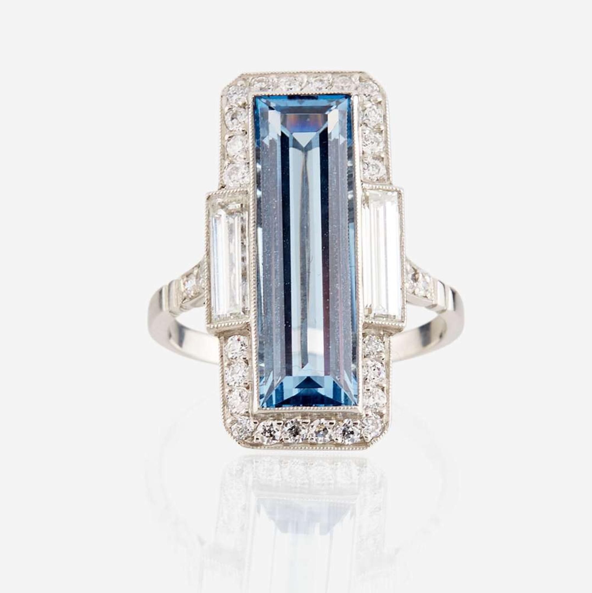 An aquamarine, diamond, and platinum ring
