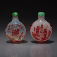 Two Chinese Ruby-Overlay Glass Snuff Bottles, Qing Dynasty, 19th Century — 清晚期 套寶石紅料及雪霏地套寶石紅料鼻煙壺兩支