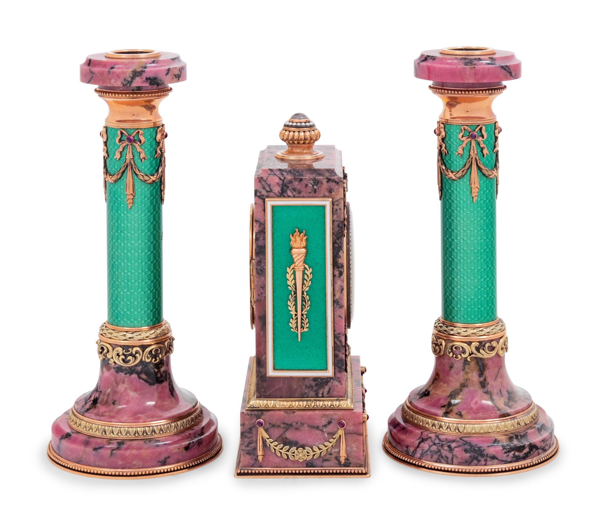A Carved Hardstone, Enamel, 14-Karat Gold and Hardstone Mounted Three-Piece Clock Garniture