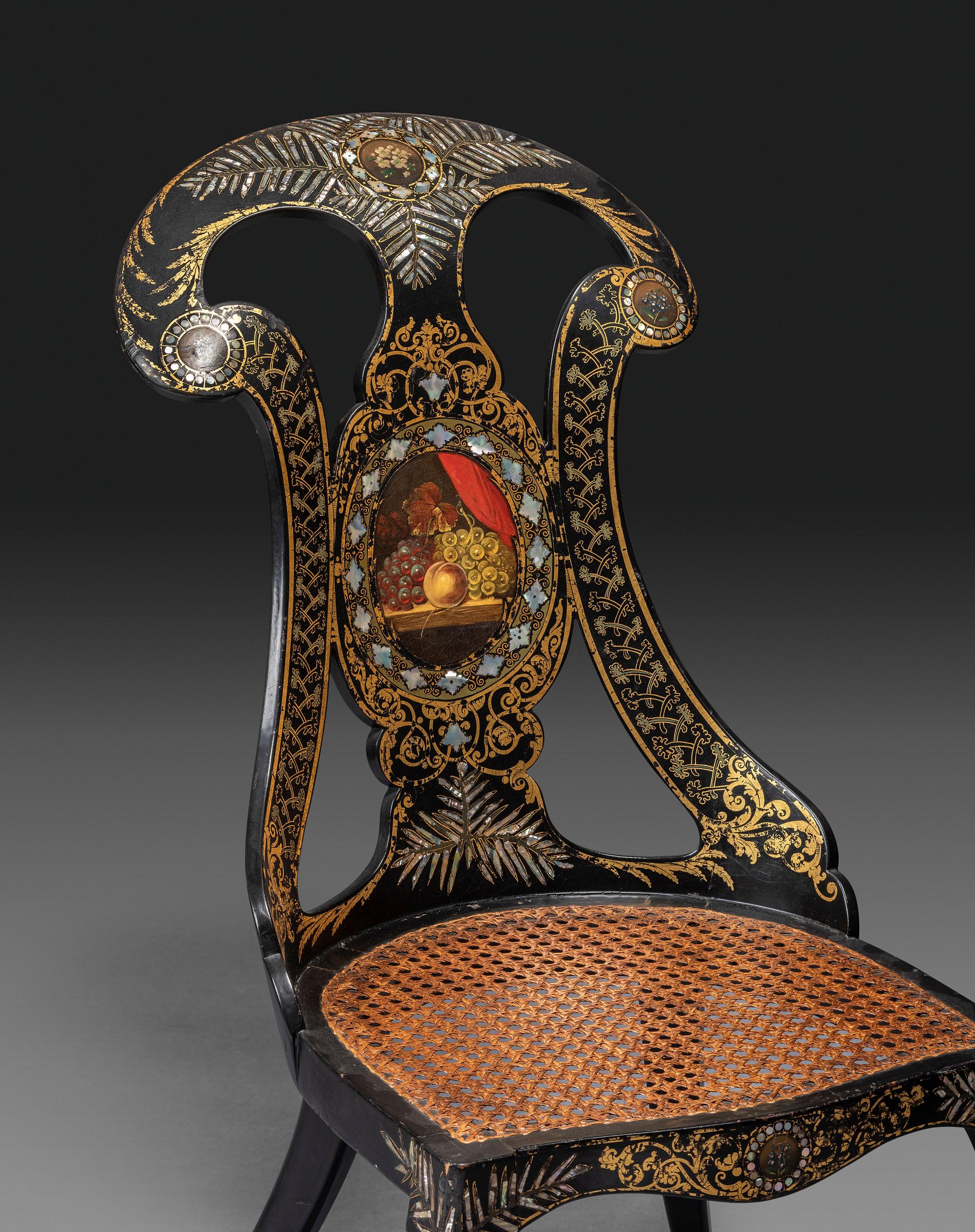 Two Victorian Black Lacquered Parcel-Gilt and Mother-of-Pearl Inlaid Cane Upholstered Slipper Chairs