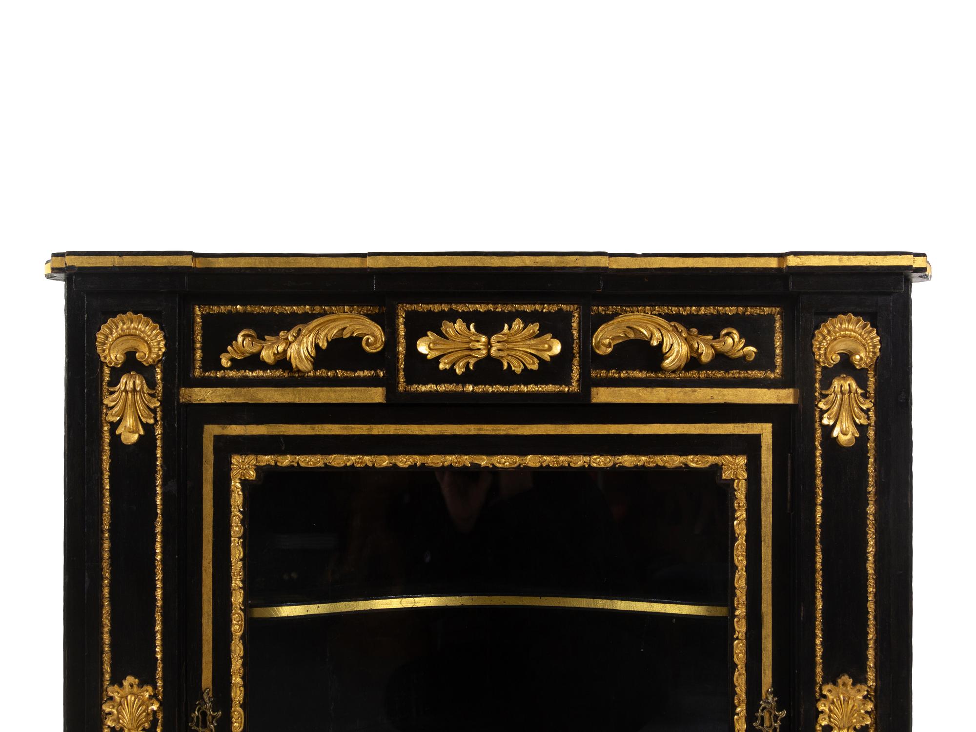 A Napoleon III Style Parcel Gilt and Ebonized Marble-Top Corner Cabinet