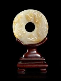 A Celadon and Russet Jade Bi Disk