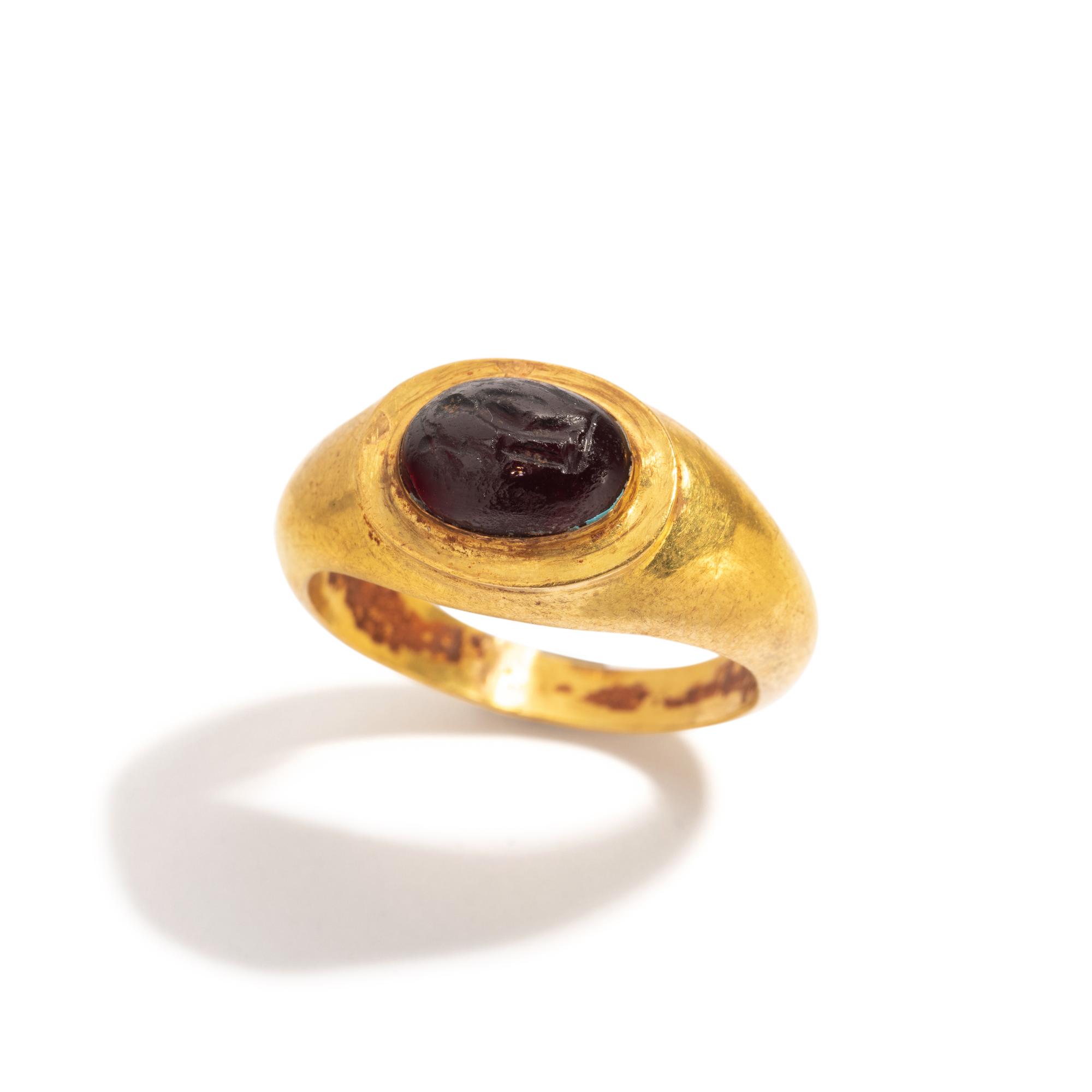 A Roman Gold and Garnet Finger Ring with the Goddesses Athena and Nike