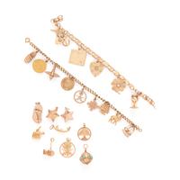 COLLECTION OF YELLOW GOLD CHARM BRACELETS