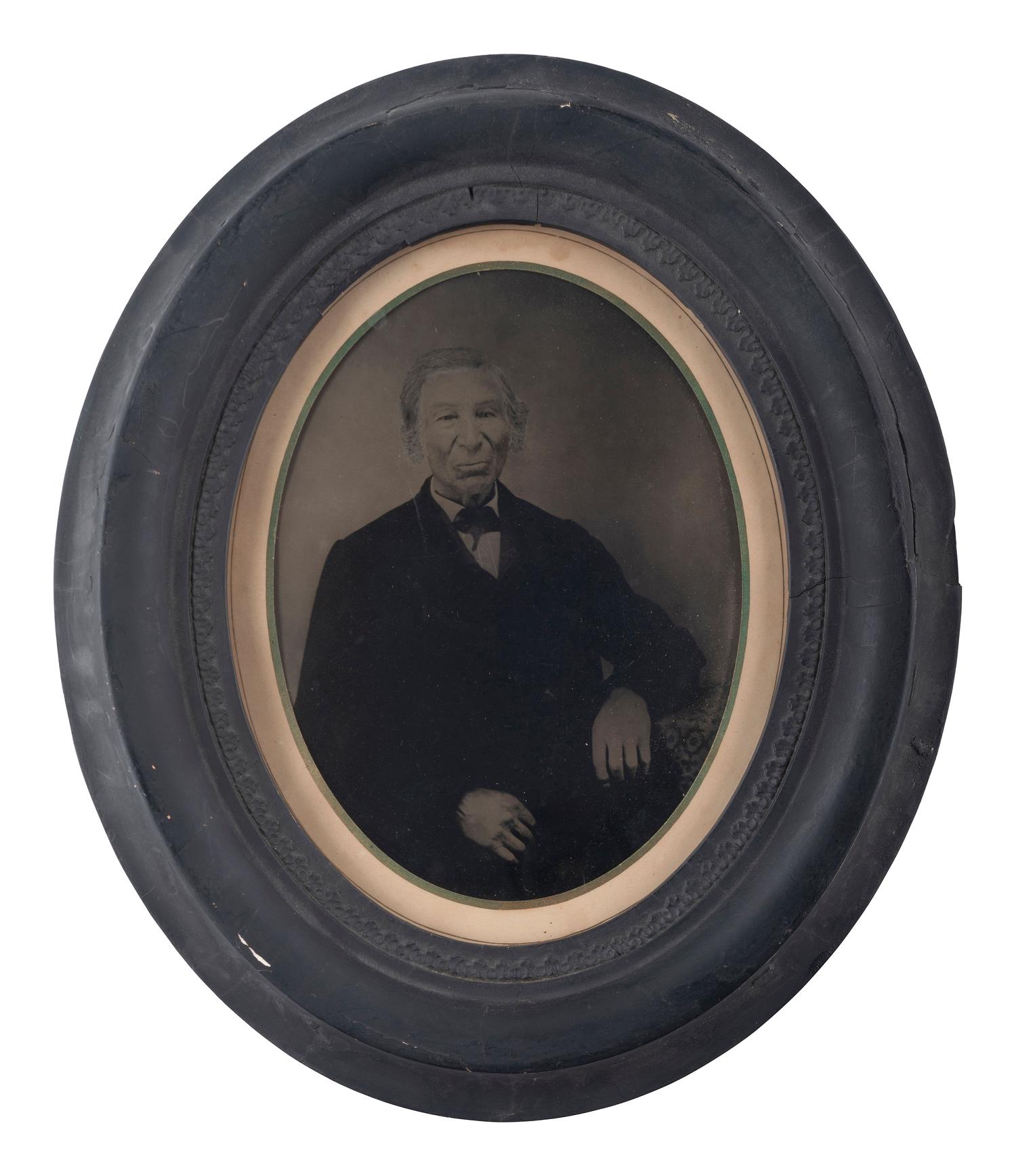 [EARLY PHOTOGRAPHY]. Full plate tintype of a possibly mixed-race gentleman in period frame.