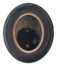 [EARLY PHOTOGRAPHY]. Full plate tintype of a possibly mixed-race gentleman in period frame.