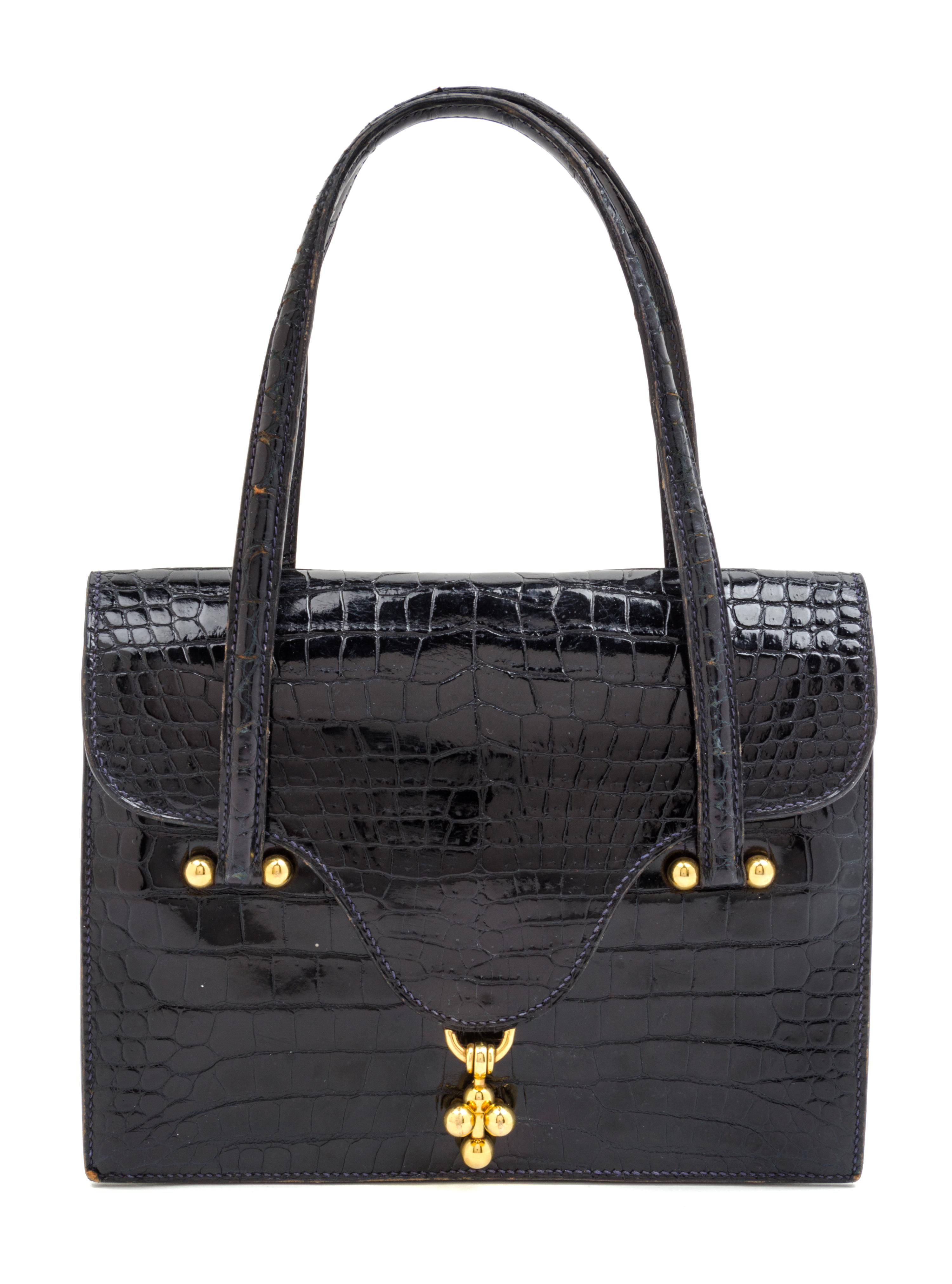 An Hermes Navy Crocodile Double Handle Handbag. 8.5" x 7" x 1.5".