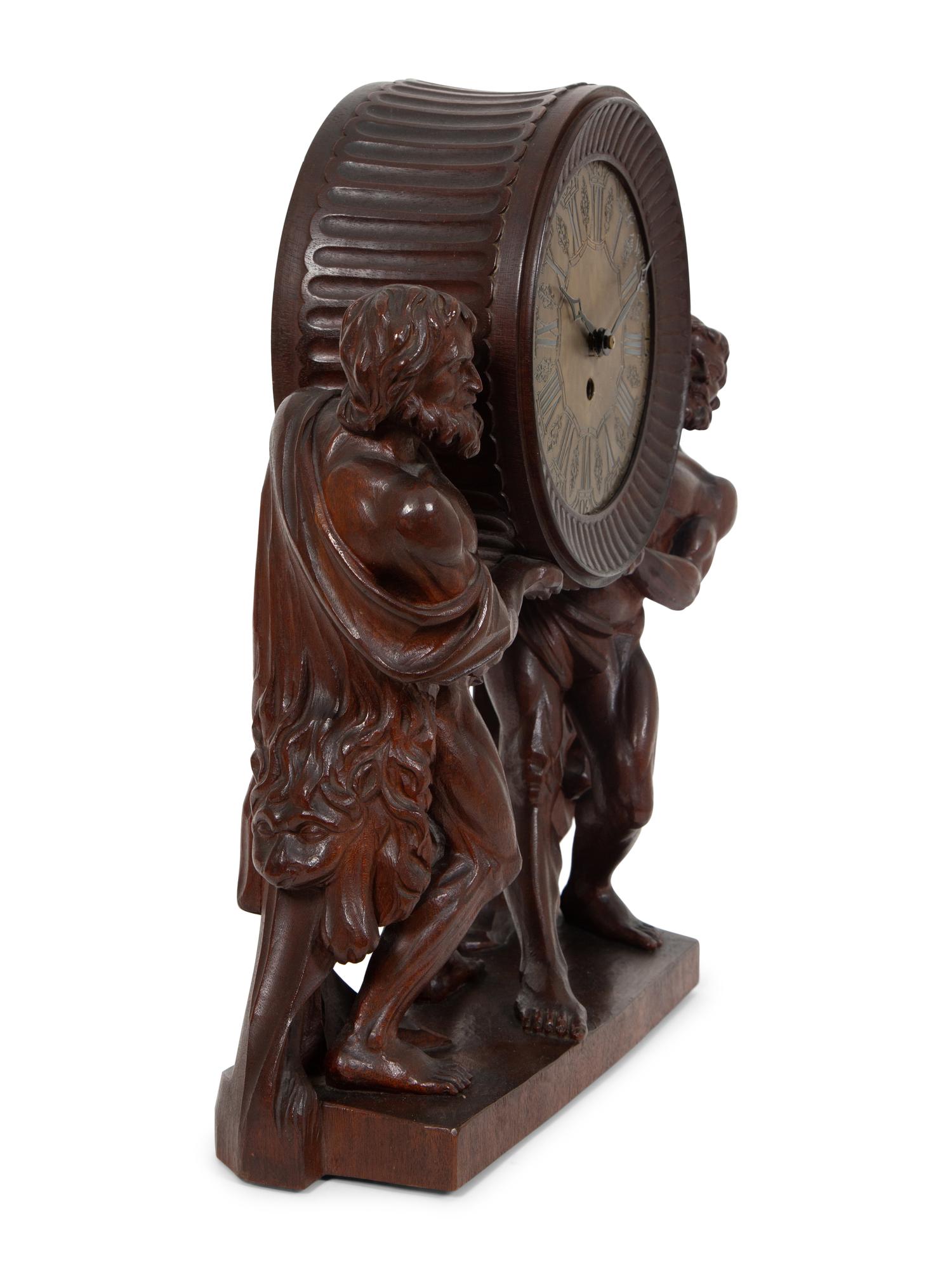 A Continental Carved Oak Figural Clock