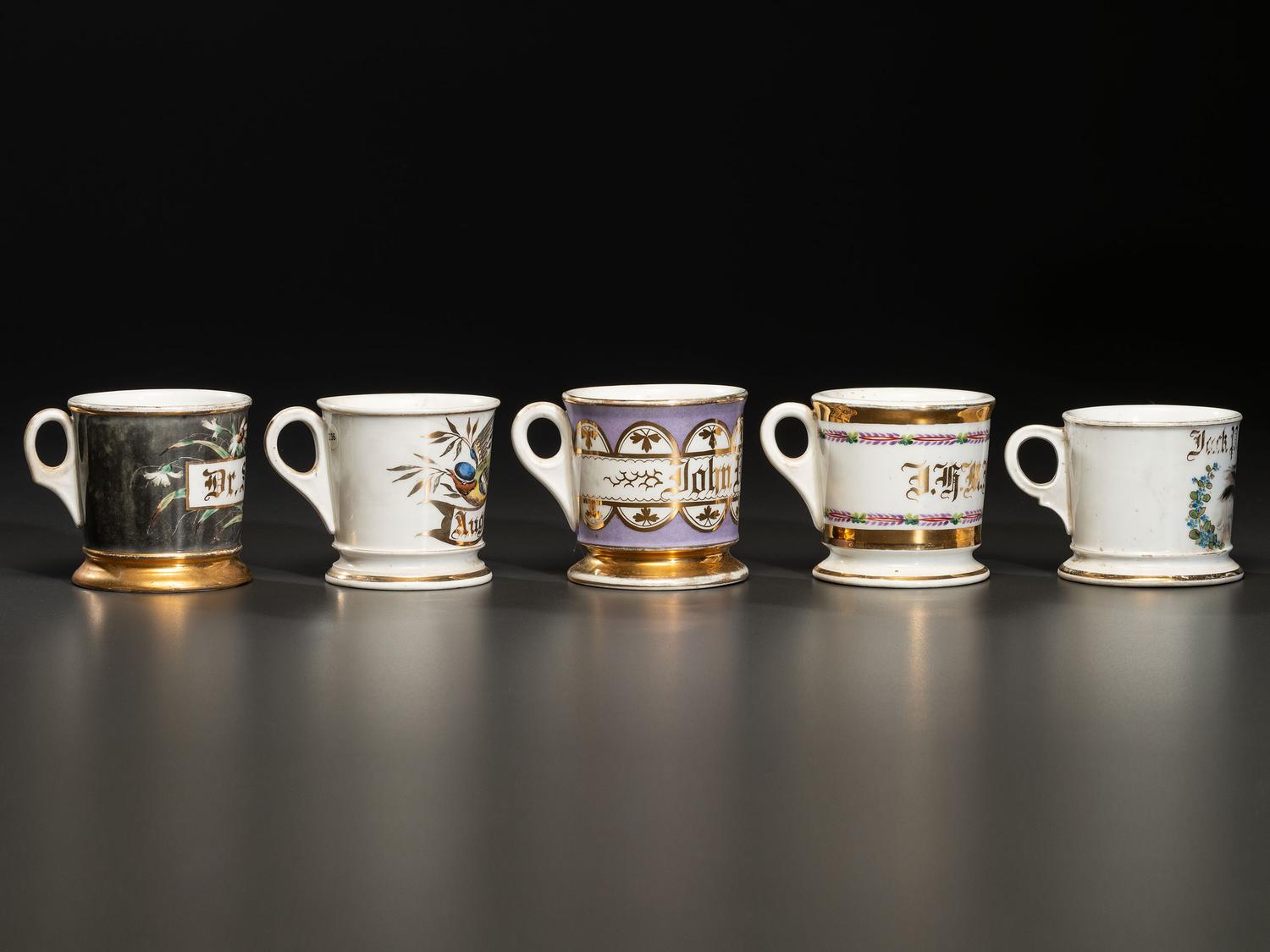 Five Porcelain Shaving Mugs with Floral and Foliate Decoration