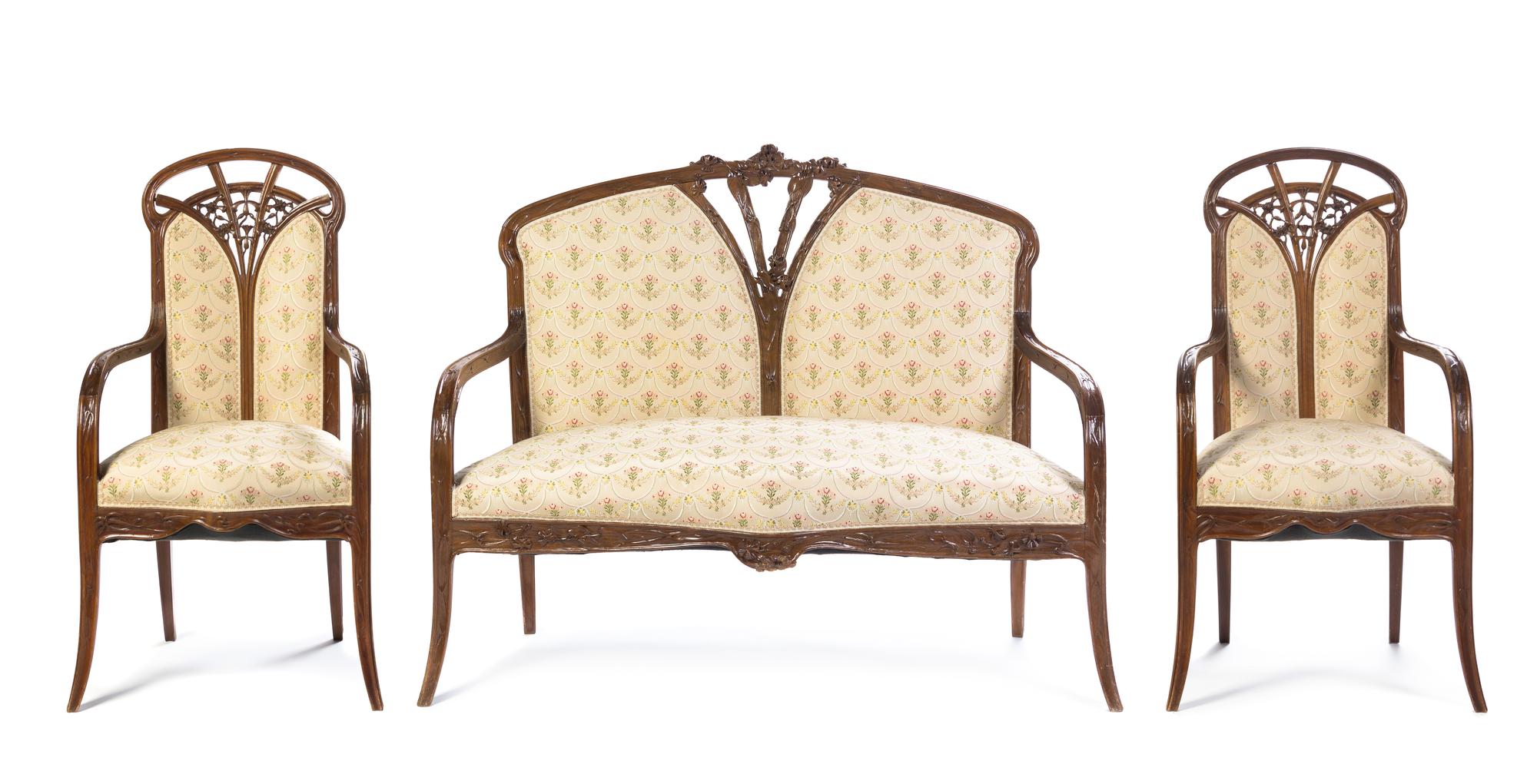 A French Art Nouveau Three Piece Carved Fruitwood Salon Suite, Louis Majorelle Length of settee 51 inches.