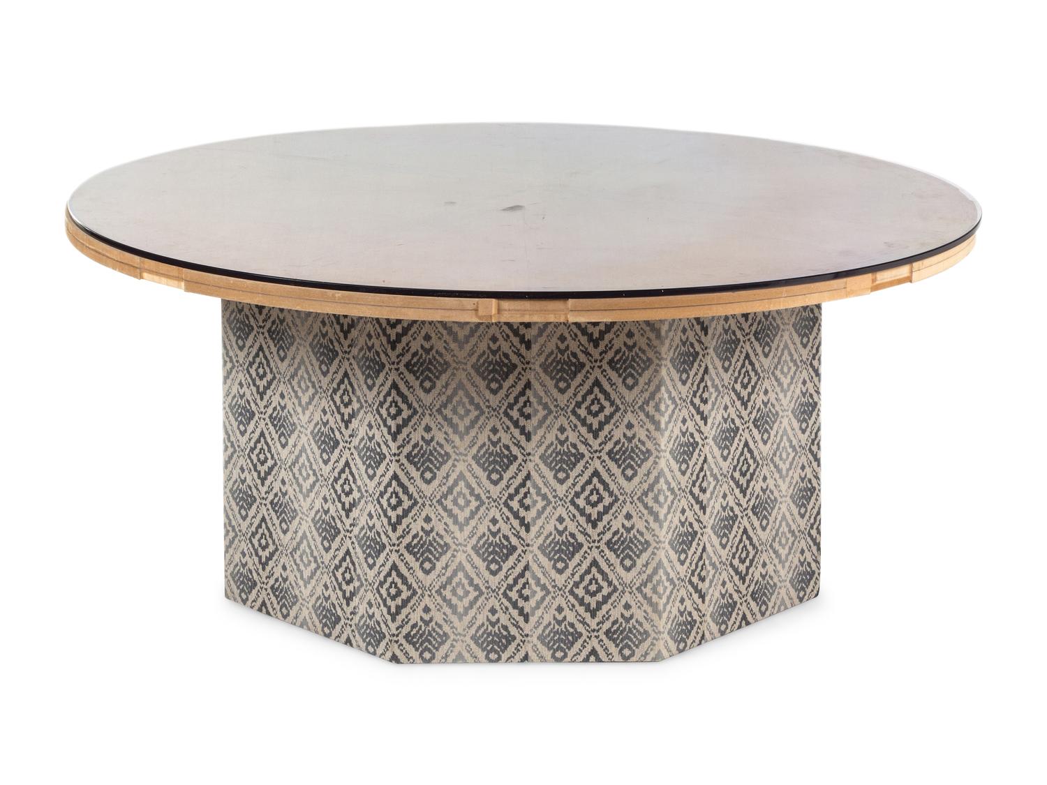 A Contemporary Octagonal Upholstered Dining Table Base with a Circular Glass Top