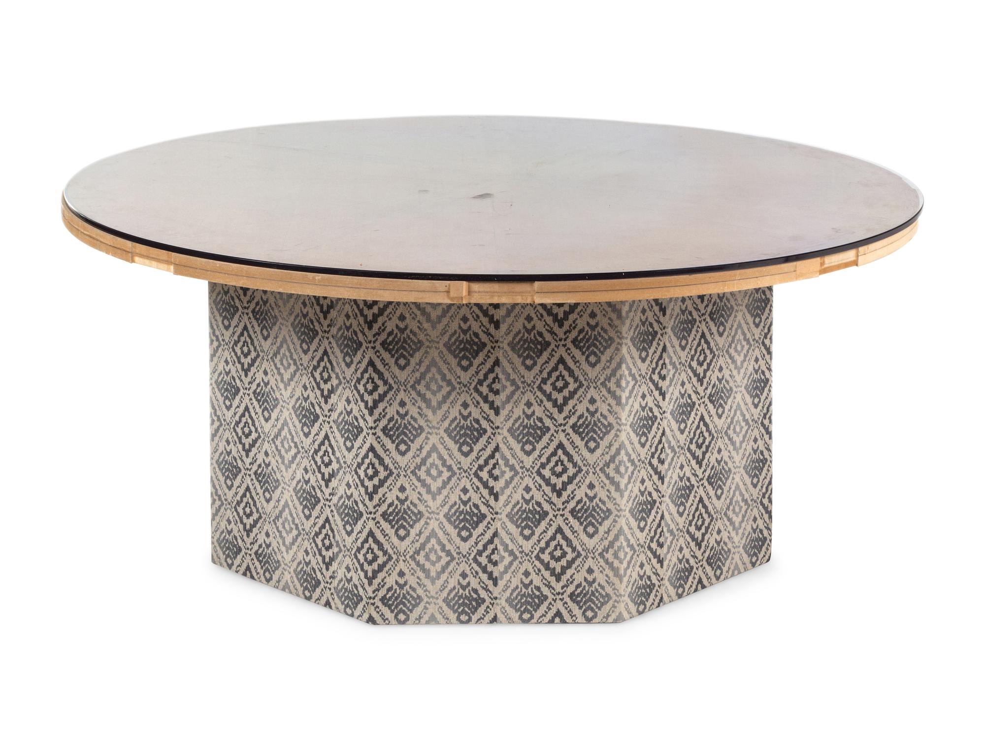 A Contemporary Octagonal Upholstered Dining Table Base with a Circular Glass Top