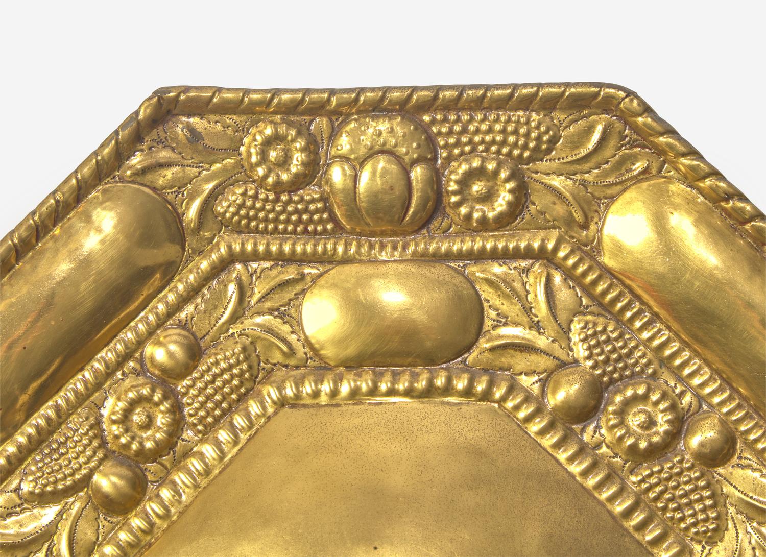 A Pair of Continental Repoussé Decorated Brass Three-Light Sconces
