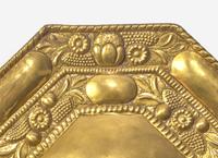 A Pair of Continental Repoussé Decorated Brass Three-Light Sconces