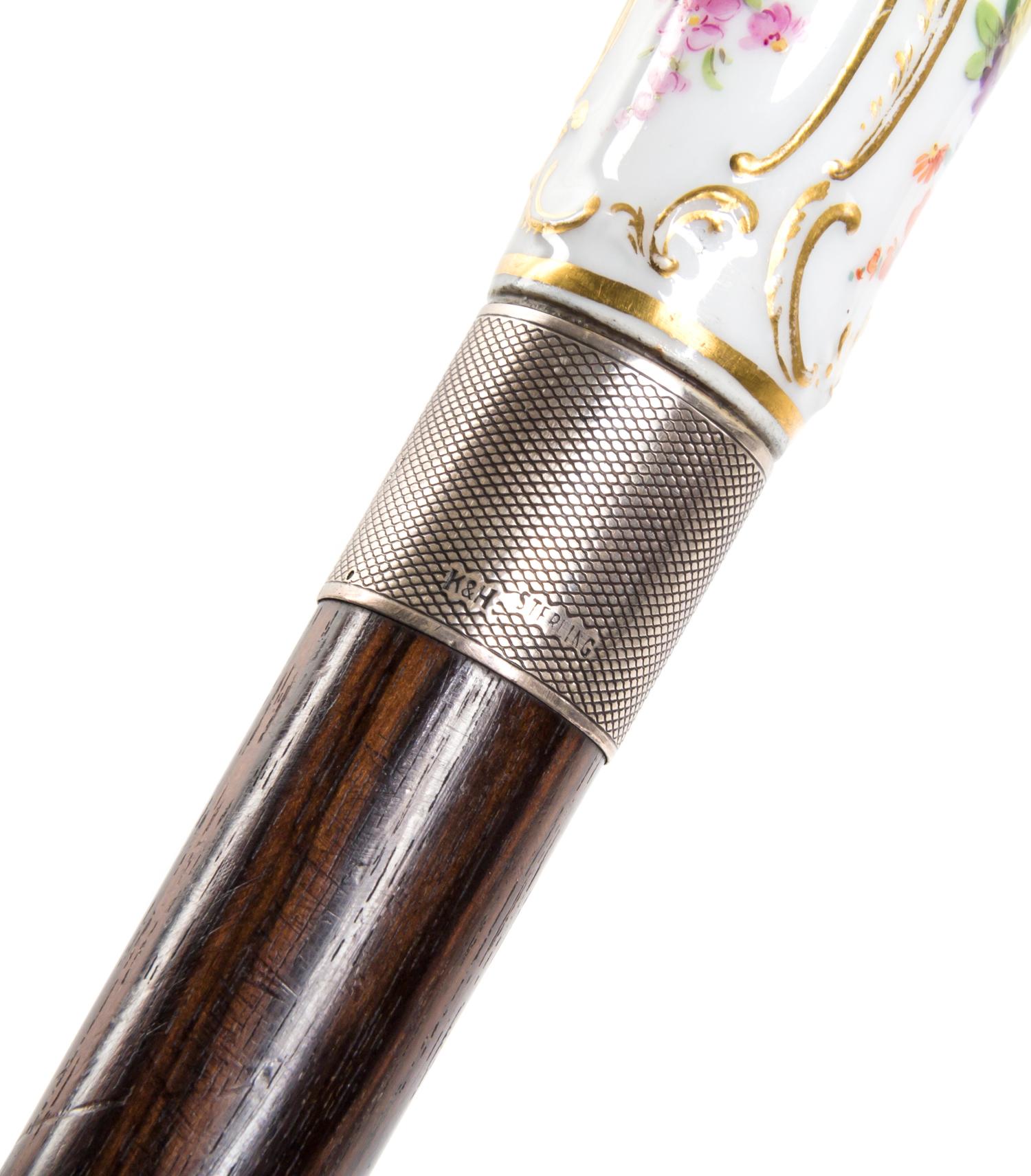 A Meissen Style Porcelain Handled Walking Stick, Length of handle 2 3/4 x length overall 31 1/2 inches.