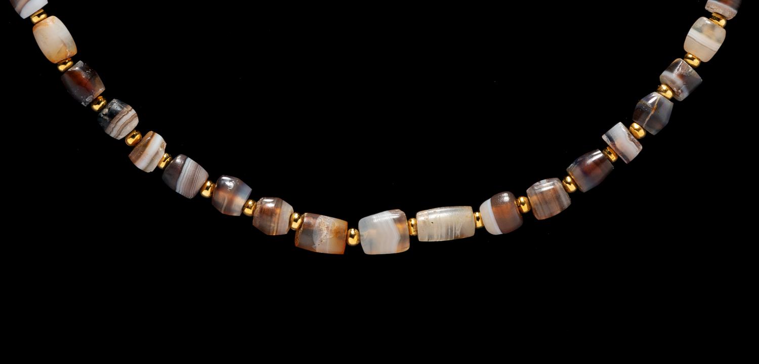 A Western Asiatic Banded Agate Necklace