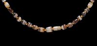 A Western Asiatic Banded Agate Necklace