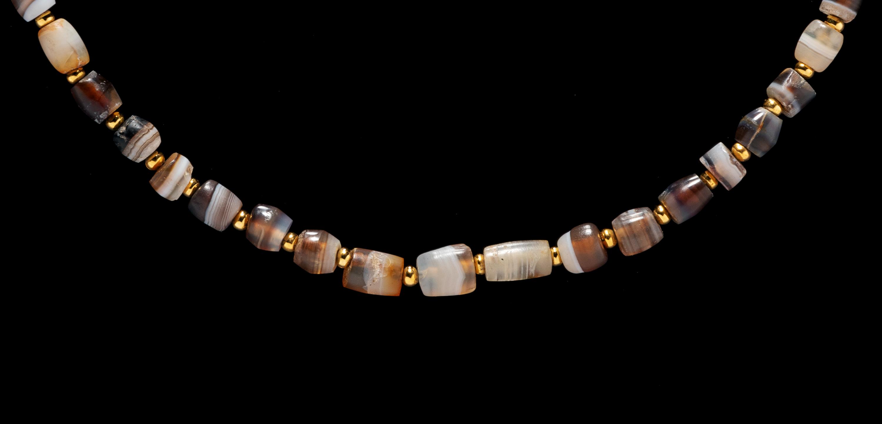 A Western Asiatic Banded Agate Necklace