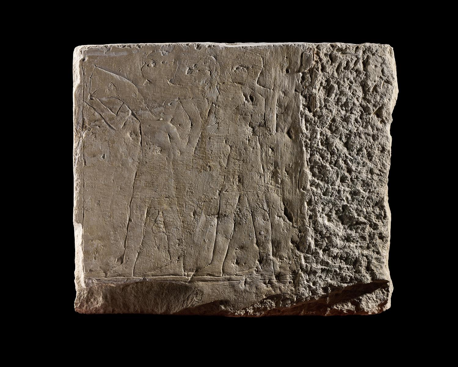An Egyptian Limestone Relief Fragment Depicting an Offering Scene