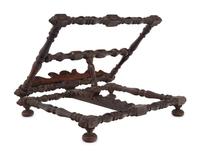 An Italian Carved Walnut Book Stand