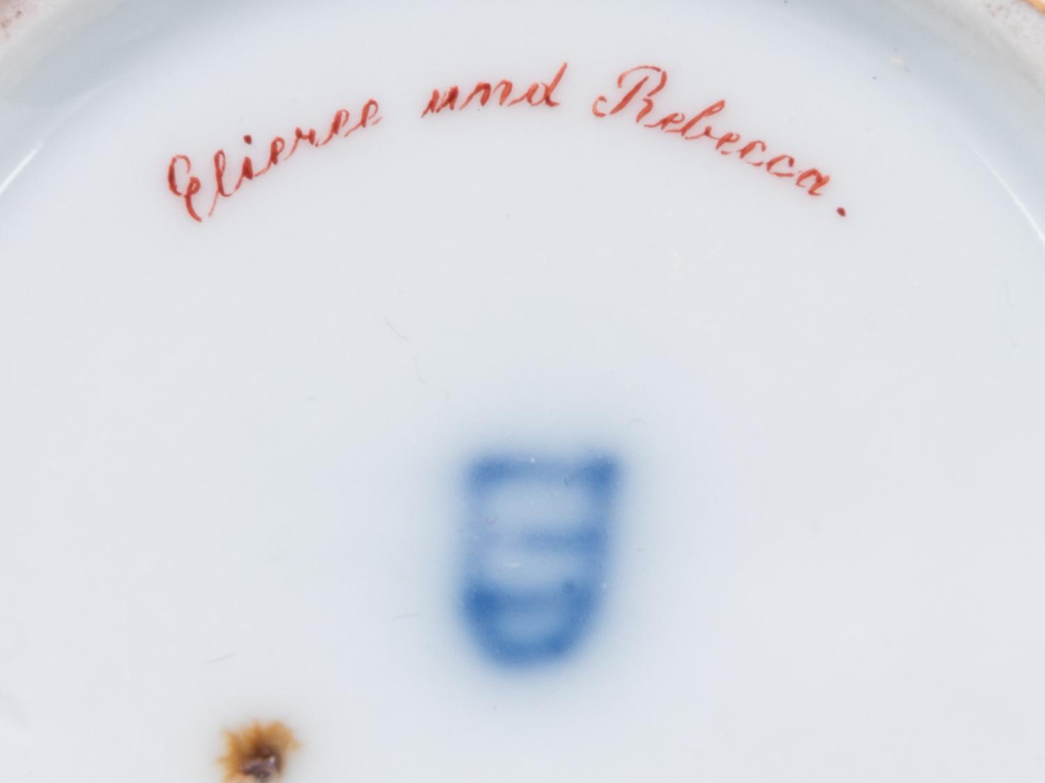 A Vienna Painted and Parcel Gilt Porcelain Teacup and Saucer