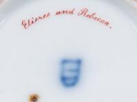 A Vienna Painted and Parcel Gilt Porcelain Teacup and Saucer