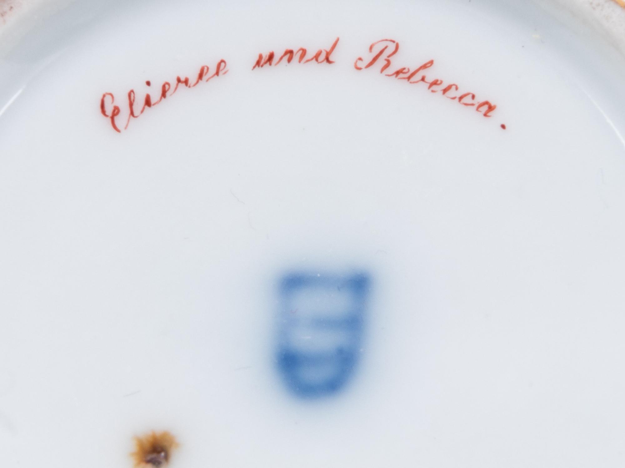 A Vienna Painted and Parcel Gilt Porcelain Teacup and Saucer