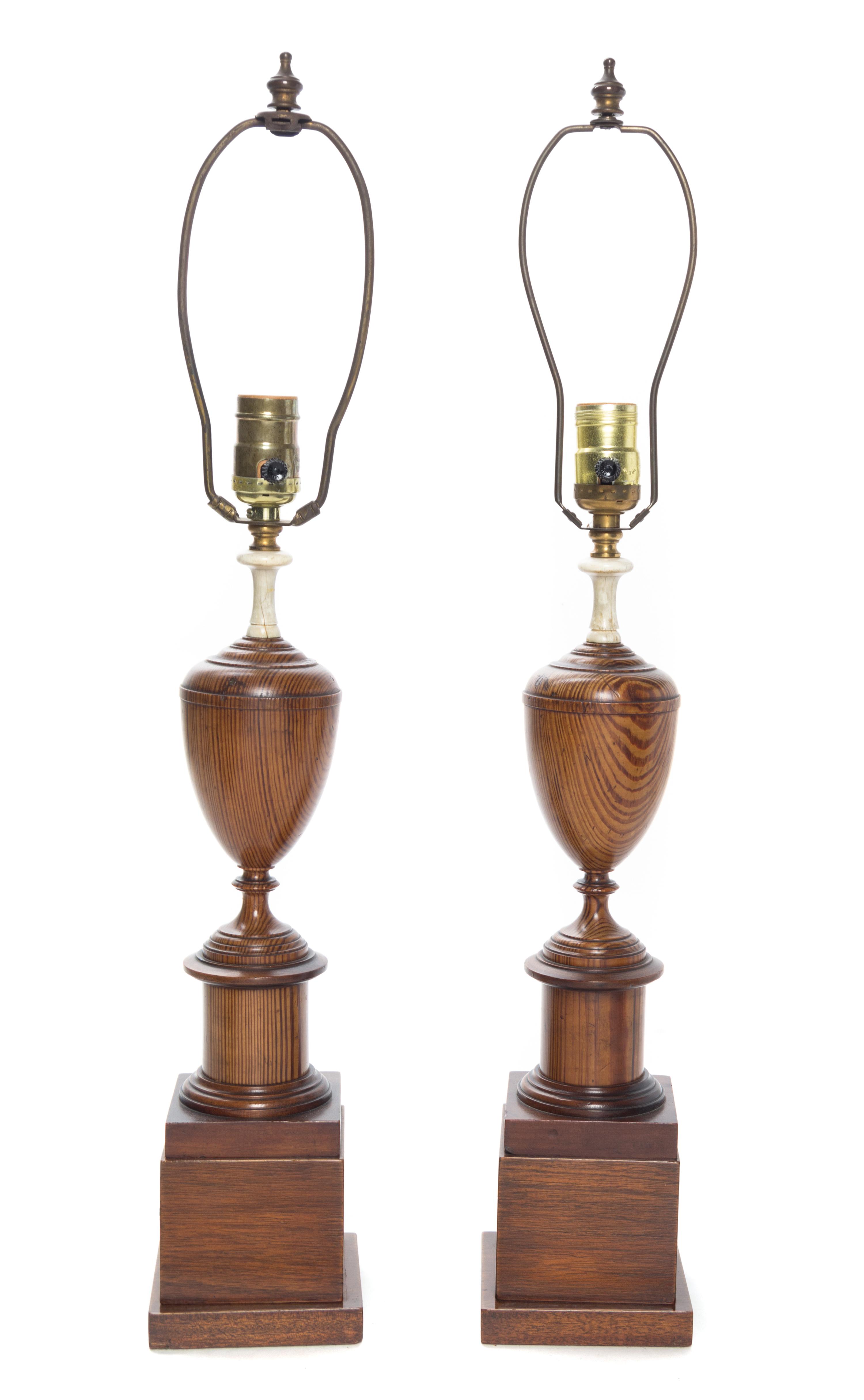 A Pair of English Turned Oak Urns Height overall 25 inches.