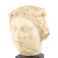 A Continental Carved Marble Head of a Woman