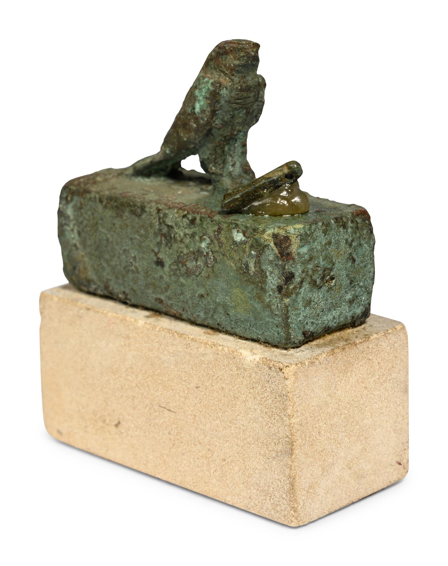 An Egyptian Bronze Falcon Coffin