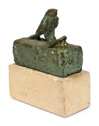 An Egyptian Bronze Falcon Coffin