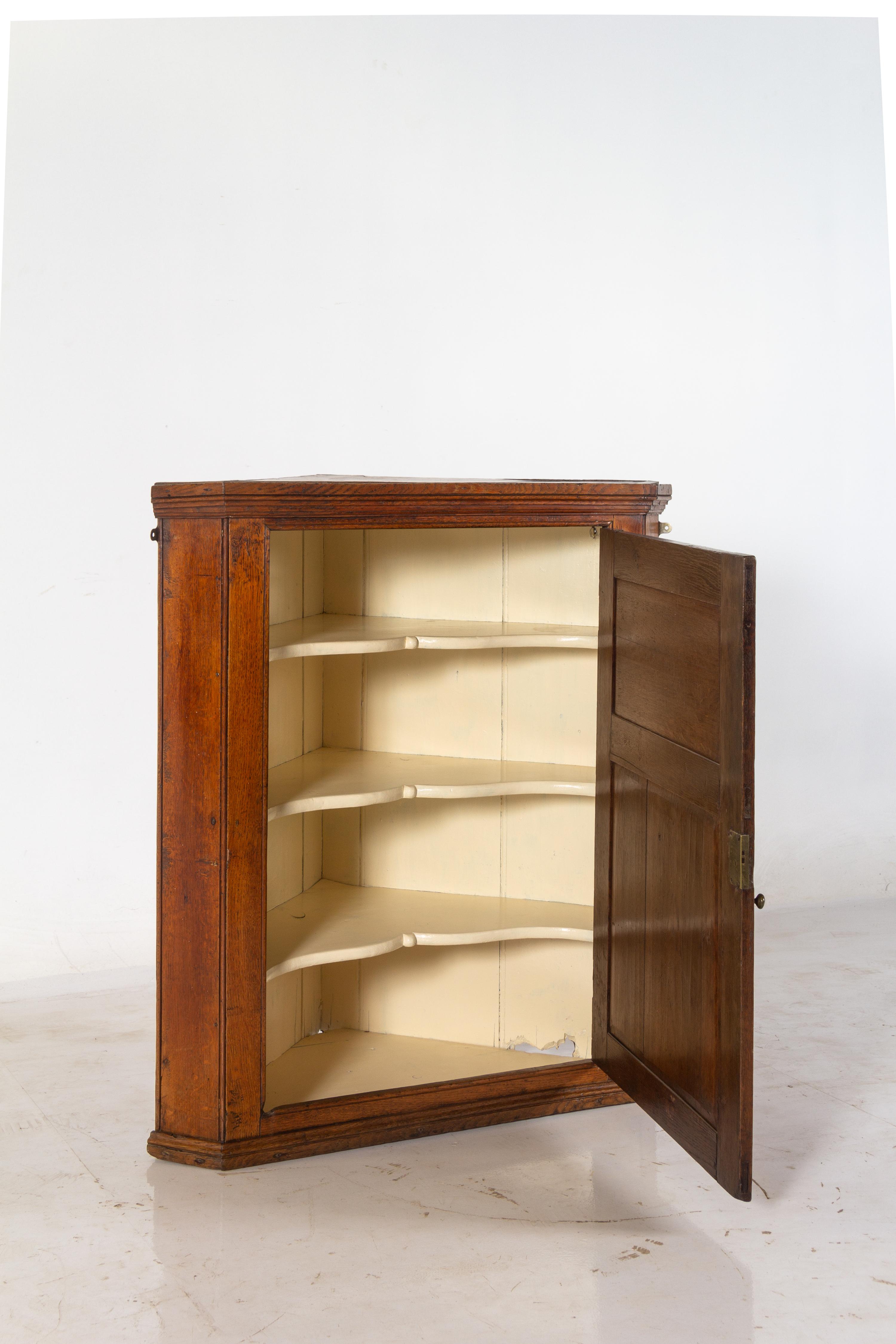 A George III Oak Hanging Corner Cupboard