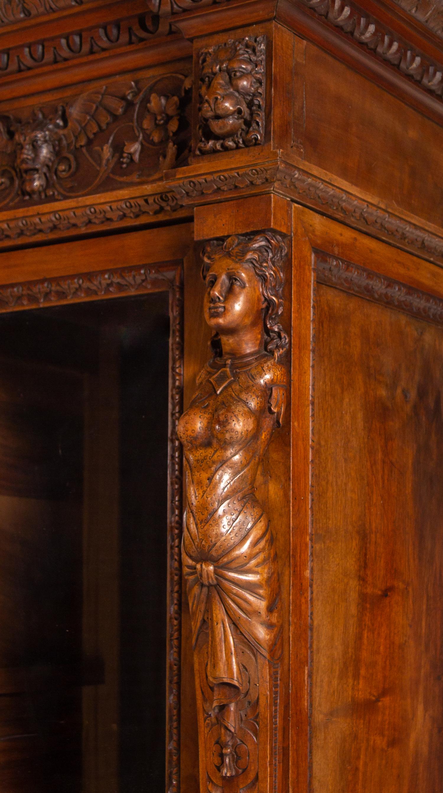 An Italian Renaissance Style Carved Walnut Cabinet