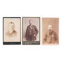 [WESTERN AMERICANA]. A group of 3 cabinet photographs of lawmen wearing badges from Illinois, Nebraska, and Oregon, comprising: