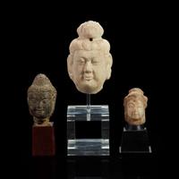 Three Chinese carved stone small heads