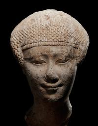 An Egyptian Limestone Head of a Noblewoman