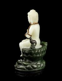 A Pale Celadon and Spinach Jade Figure of Guanyin