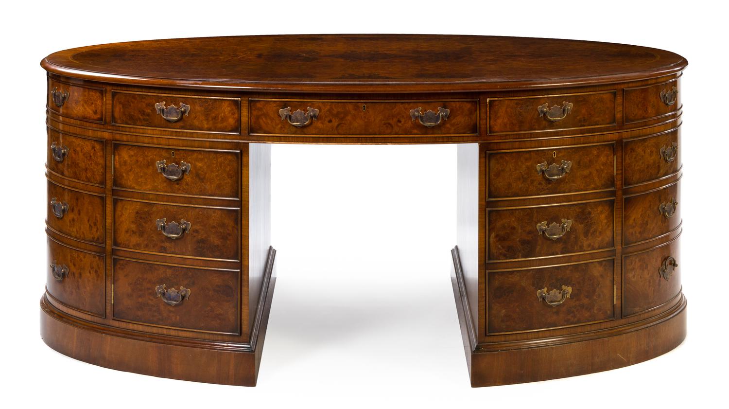 A Georgian Style Burlwood Double Pedestal Desk Height 30 3/4 x width 72 1/2 inches x depth 39 1/2 inches. — 20TH CENTURY