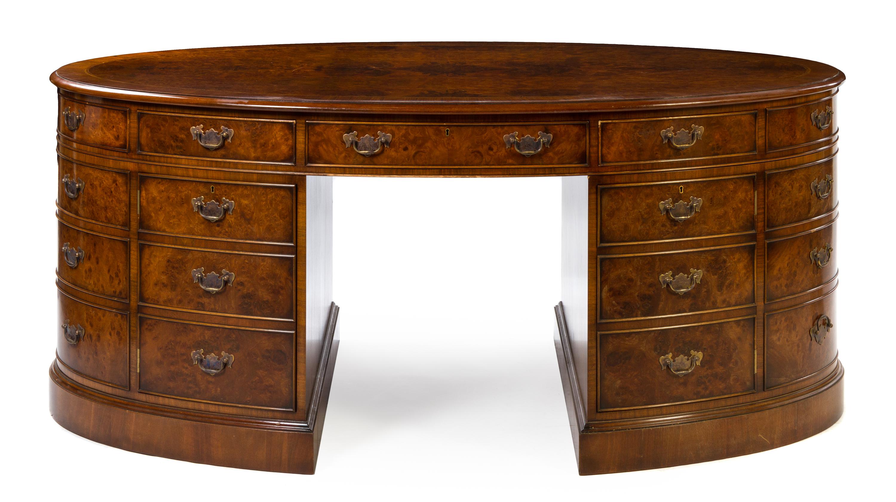 A Georgian Style Burlwood Double Pedestal Desk Height 30 3/4 x width 72 1/2 inches x depth 39 1/2 inches. — 20TH CENTURY