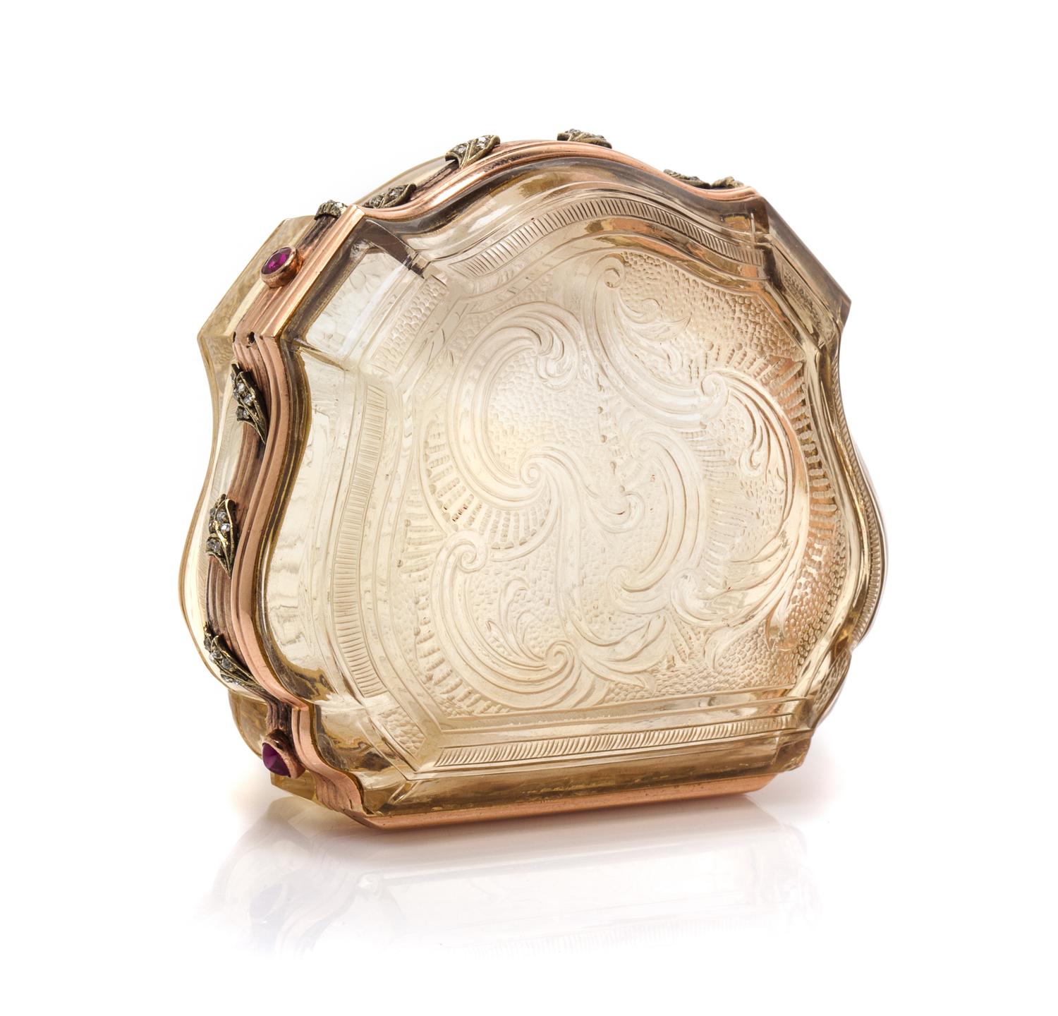 A Russian Gold Mounted and Jeweled Carved Topaz Box, St. Petersburg, 19th Century, of shield form with incised rocaille decoration, wit