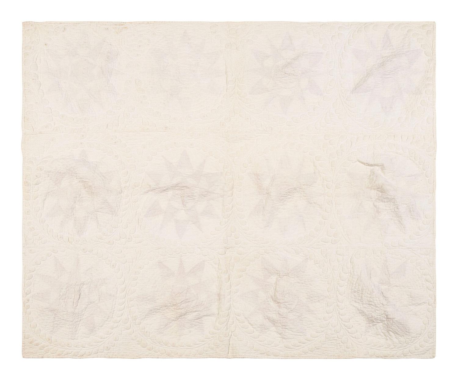 A Pieced and Trapunto Crib Quilt